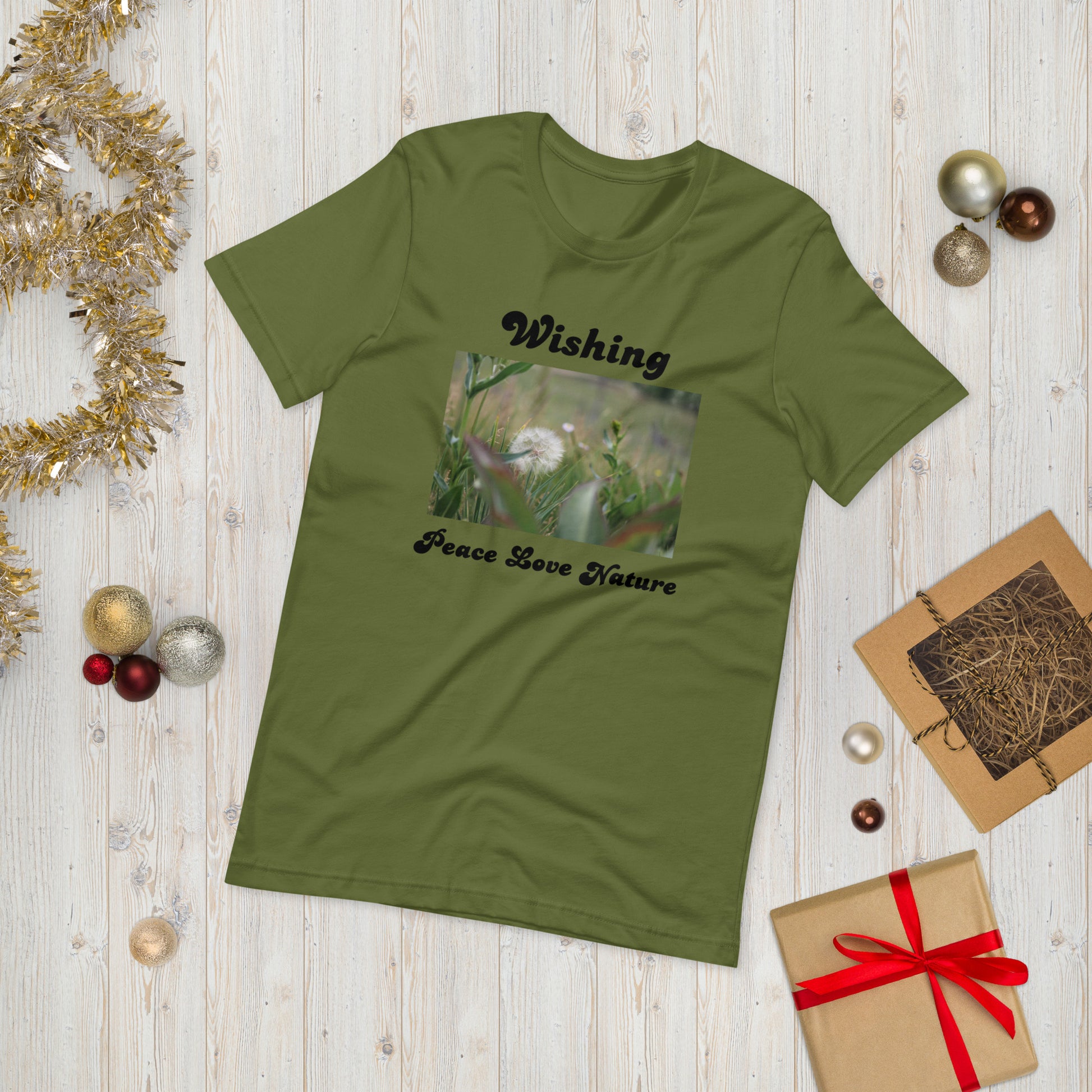 Green T-shirt with picture of dandelion wisher written words Wishing Peace Love Nature 